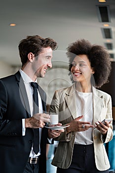 Young couple of professionals chatting during a coffee break