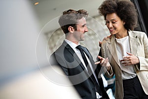 Young couple of professionals chatting during a coffee break