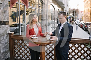 Young couple of professionals chatting during a coffee break