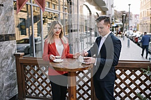 Young couple of professionals chatting during a coffee break