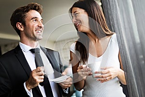 Young couple of professionals chatting during a coffee break