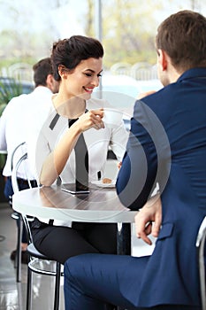 Young couple of professionals chatting during a coffeebreak