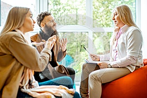 Young couple during the psychological counseling with psychologist