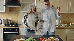 Young couple quarrels in the kitchen at home