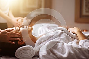 Young couple receiving head massage at beauty spa