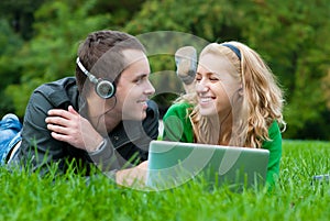 Young couple relax and listen to music