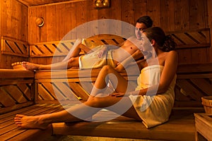 Young couple relaxing in a hot sauna