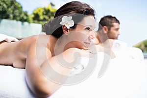 Young couple relaxing on massage table