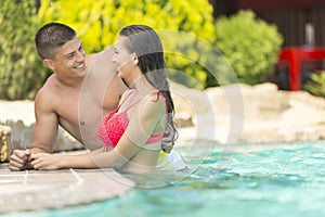 Young couple relaxing in the pool