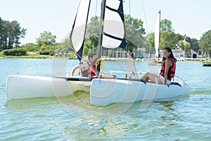 young couple relaxing on sailing vessel