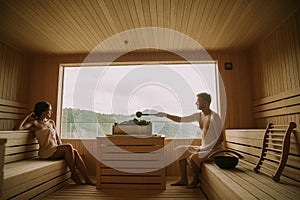 Young couple relaxing in the sauna