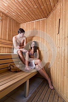 Young couple relaxing in the sauna