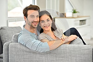Young couple relaxing on sofa at home