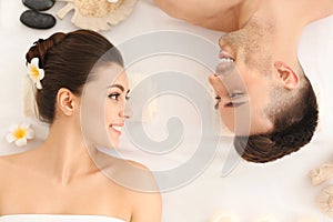 Young couple relaxing in spa salon