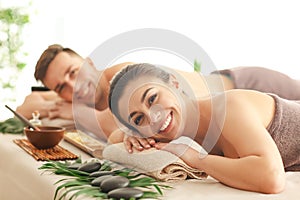 Young couple relaxing in spa salon