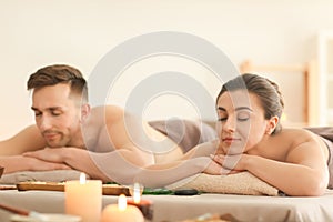 Young couple relaxing in spa salon