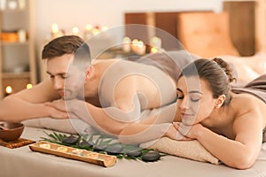 Young couple relaxing in spa salon