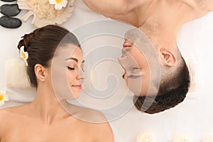 Young couple relaxing in spa salon