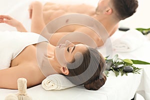 Young couple relaxing in spa salon