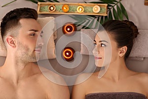 Young couple relaxing in spa salon