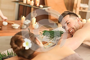 Young couple relaxing in spa salon