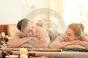 Young couple relaxing in spa salon