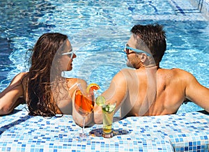Young couple are relaxing at swimming pool