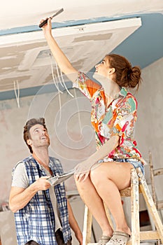 Young couple renovating home photo