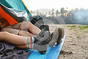 Young couple resting in camping tent