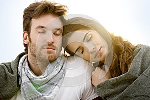 Young couple resting in summer sunshine