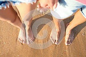 Young couple resting together at beach, top view.