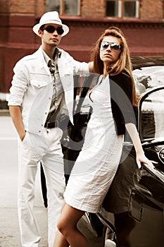 Young couple with a retro car