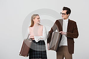 young couple in retro outfit smiling