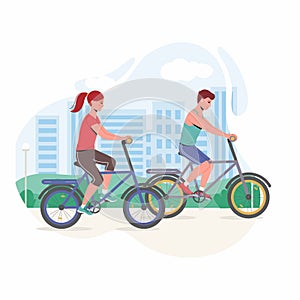 Young couple are riding on bicycle on the urban lanscape background..Man and woman spends time outdoors