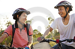 Young couple riding bike