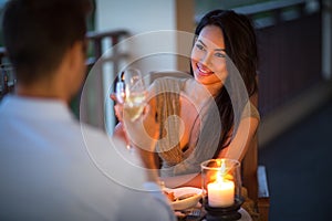 Young couple with a romantic dinner with candles