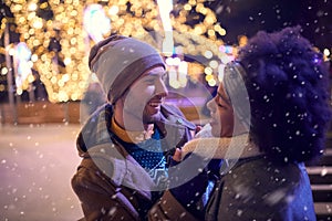 A young couple in romantic moments at ice rink. Skating, closeness, love, together