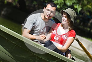 Young couple in rowboat photo