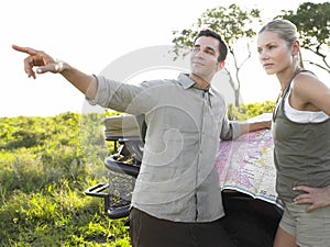 Young Couple On Safari With Map