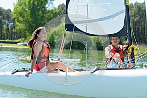 Young couple on sailing boat