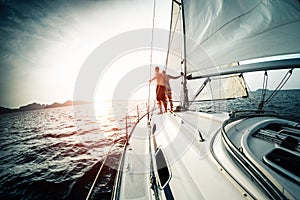 Young couple on the sailing boat