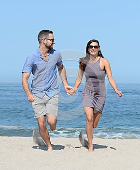Young couple on sandy beach