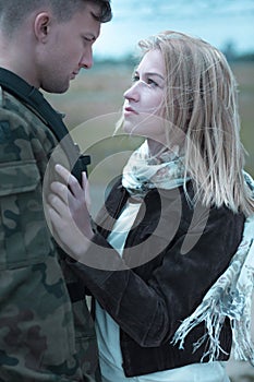 Young couple saying goodbye