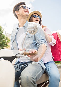 Young couple on scooter