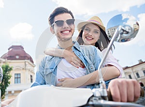 Young couple on scooter