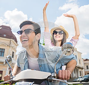 Young couple on scooter