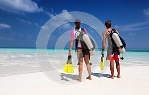 Young couple in scuba diving gear