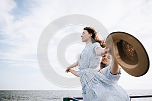 Young couple on the sea pier. The concept of freedom