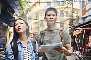 Young couple searching for places to visit