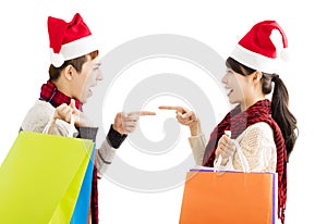 Young couple with shopping bags for christmas holiday